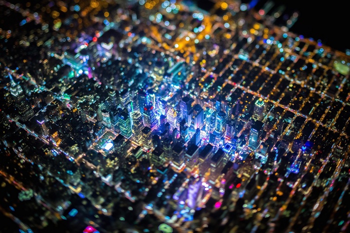 Aerial view of a city at night with tilt-shift effect