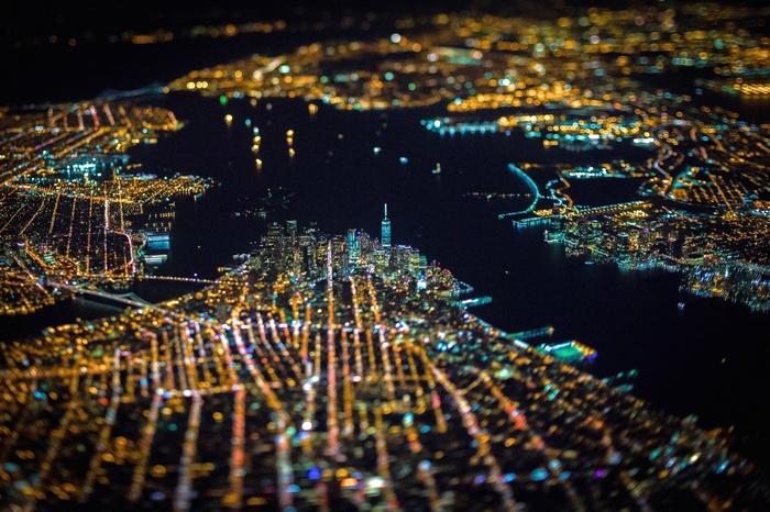 Aerial view of New York City at night with bokeh lights