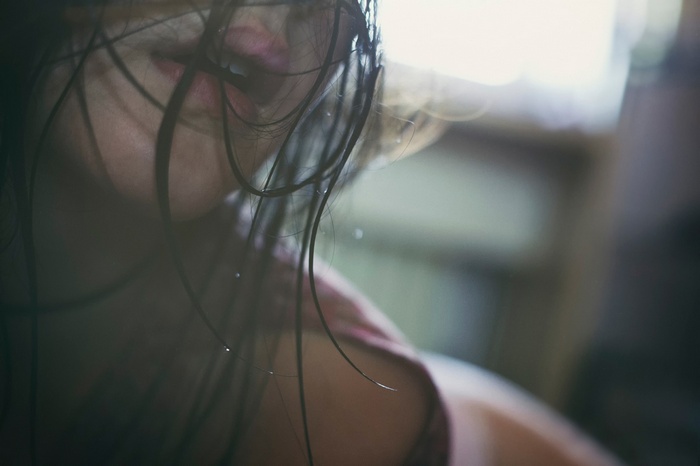 Wet brunette woman with wet hair