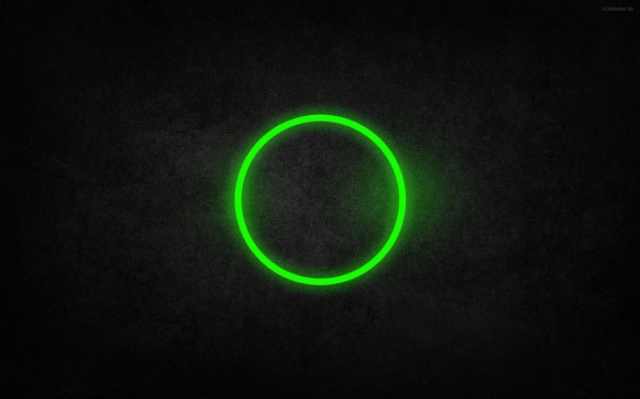 Green neon circle on dark textured background