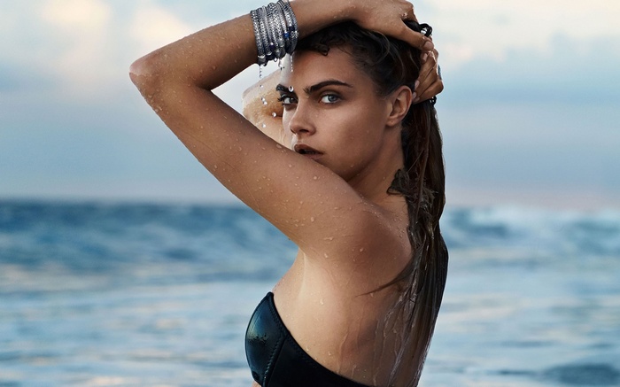 Cara Delevingne with wet hair and body on the beach