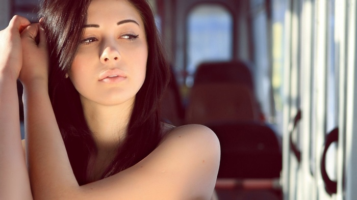 Brunette woman with long hair indoors