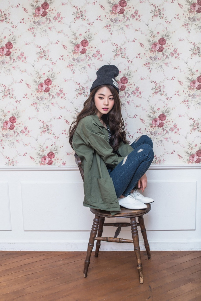 Asian woman Chae Eun sitting on a chair
