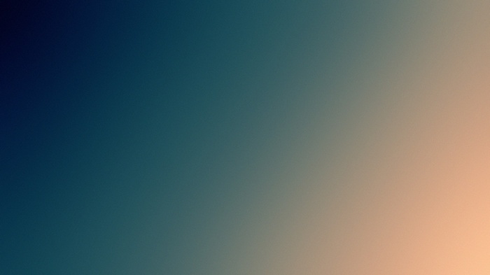 Blurred gradient background with dark blue and peach tones