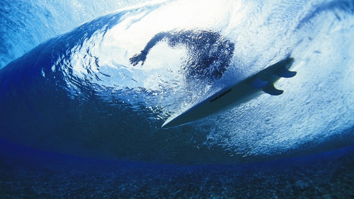 Surfer inside a wave
