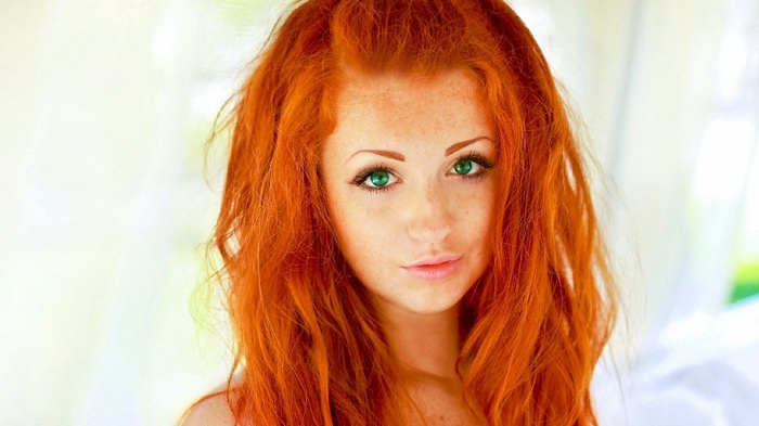 Redhead woman with green eyes and freckles