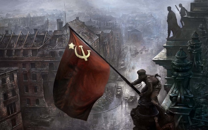 Soviet soldiers raise the USSR flag over destroyed Berlin