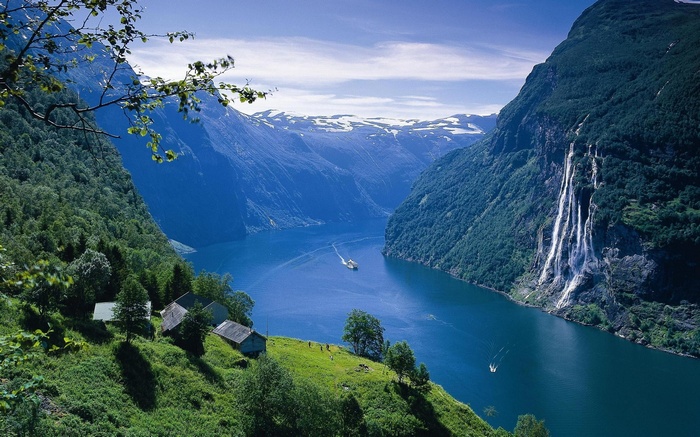 Geirangerfjord, Norway with waterfalls and a boat