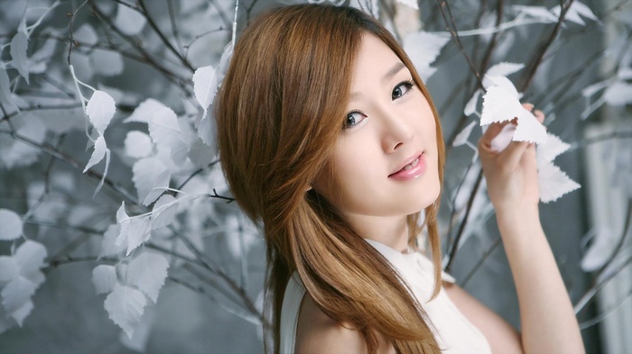 Hwang Mi Hee posing with white branches