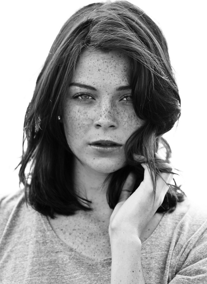 Monochrome portrait of a woman with freckles
