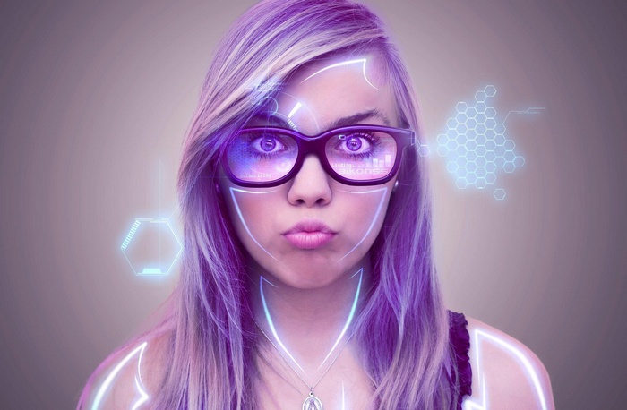 Woman with augmented reality glasses and futuristic interface