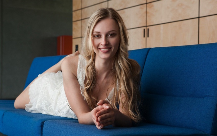 Carisha on a blue couch