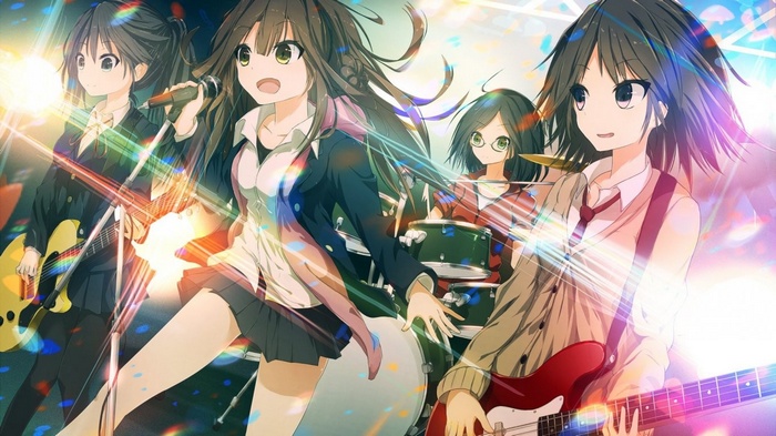 Four anime girls playing musical instruments on stage