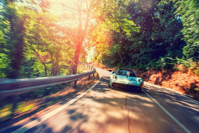Pagani Huayra driving on a winding road