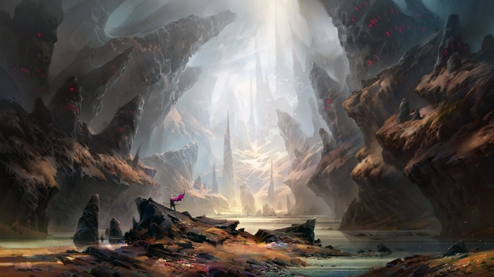 A lone figure stands on a rocky outcrop in a cavern
