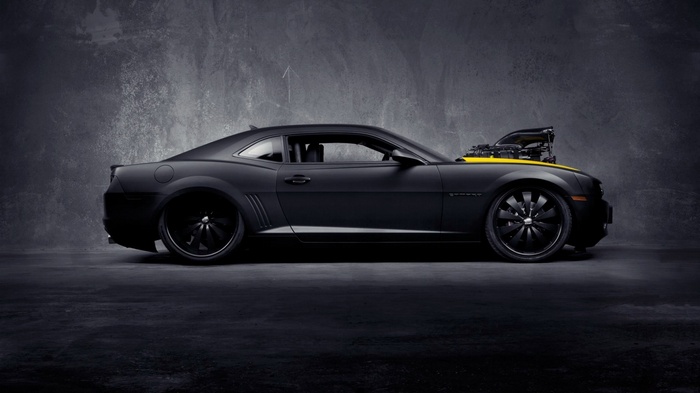 Matte black Chevrolet Camaro with exposed engine