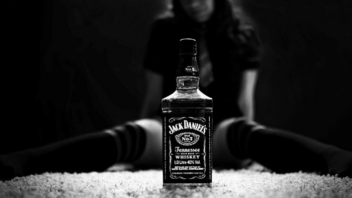 Jack Daniels bottle with a person in the background