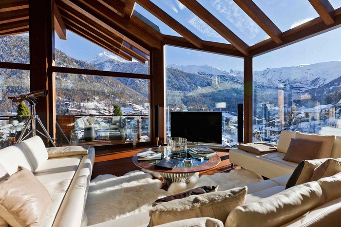 Living room with a view of snowy mountains