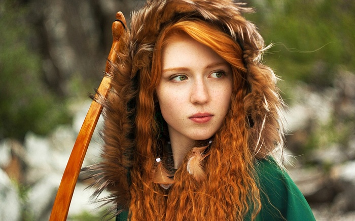 Redhead woman with bow and fur hood