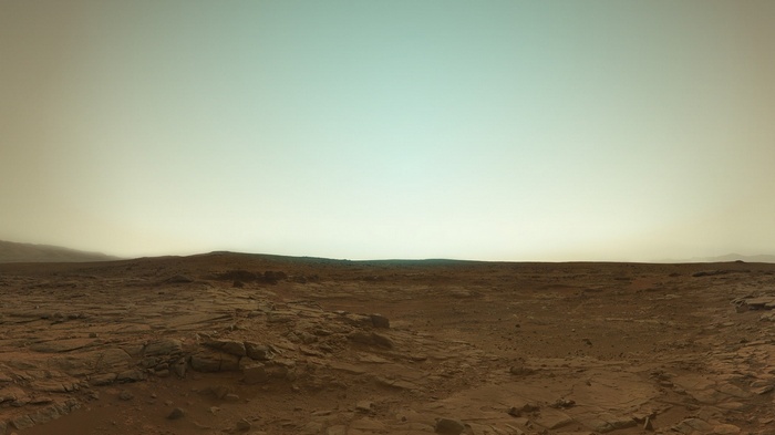 Mars landscape with rocky terrain and hazy sky