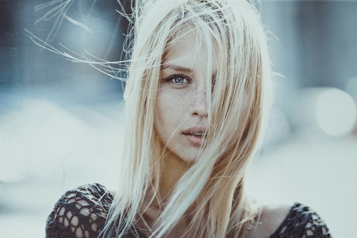 Woman with blonde hair and blue eyes