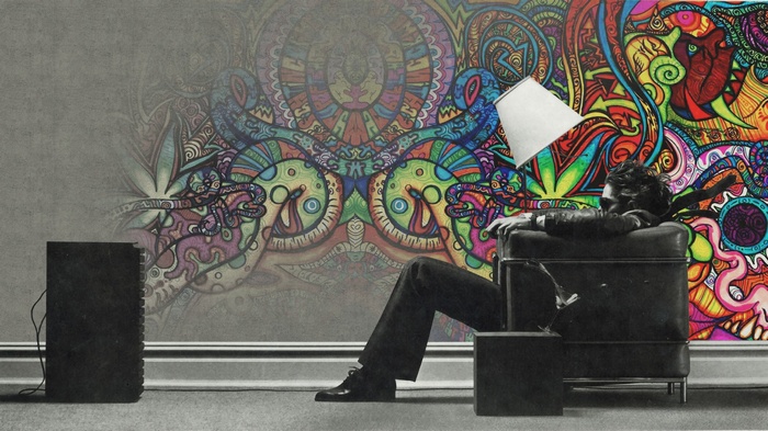 Man listening to music with colorful wall art
