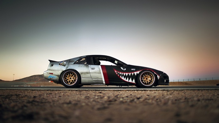 Nissan 300ZX with shark mouth livery on a race track