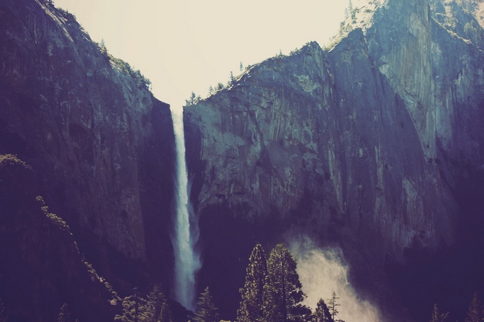 Waterfall cascading down a rocky cliff face