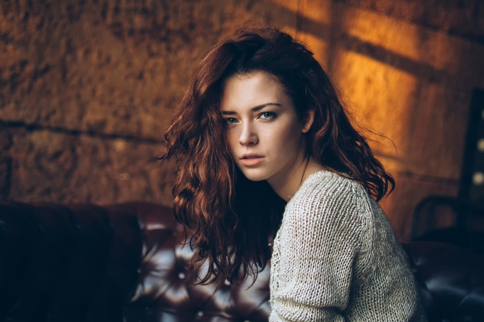Anna Zabolotskaya with long hair wearing a sweater