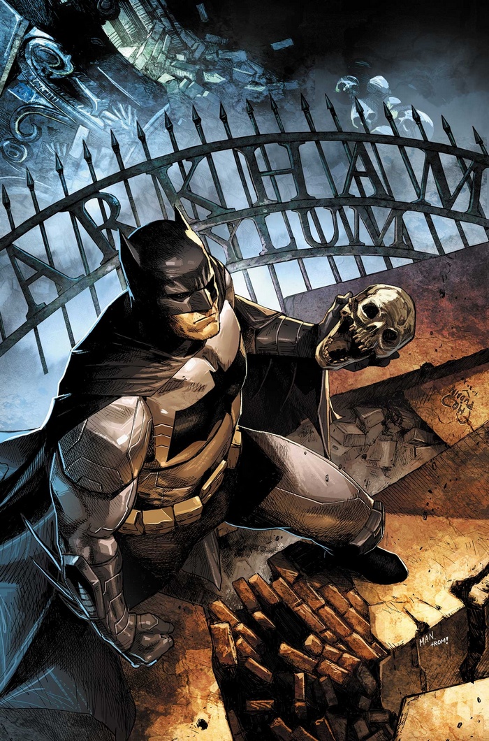 Batman holding a skull in front of a gate