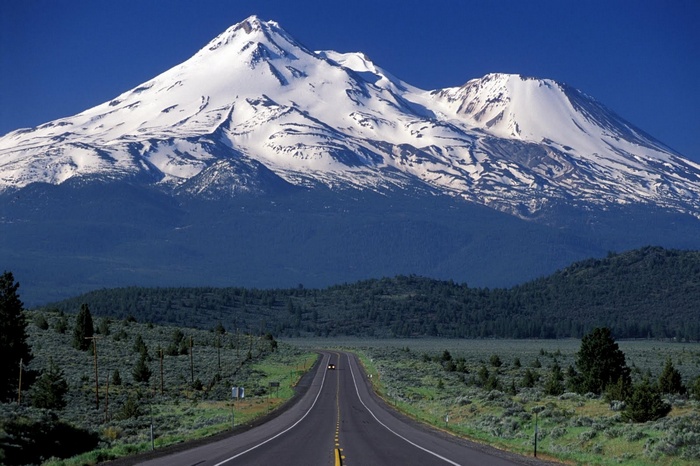 Mount Shasta with a road leading towards it