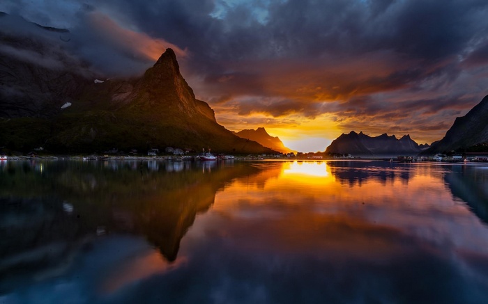 Sunset over mountains and lake in Norway