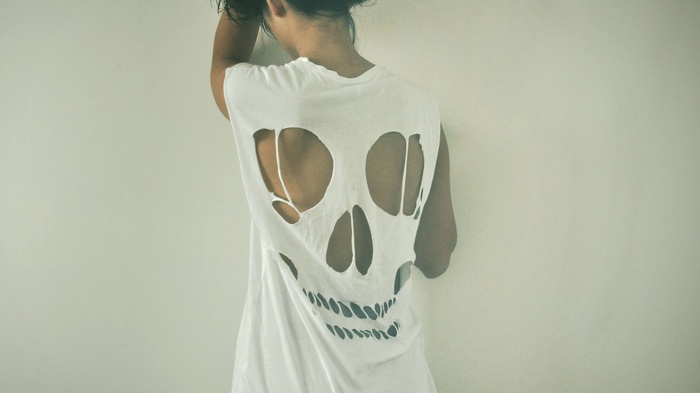 Woman in a torn skull t-shirt