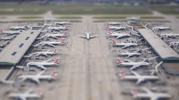 Airport with many British Airways airplanes and a terminal