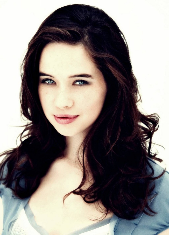 Anna Popplewell with blue eyes and brunette hair