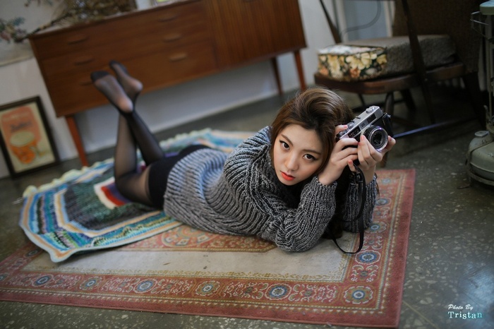 Chae Eun poses with a vintage camera