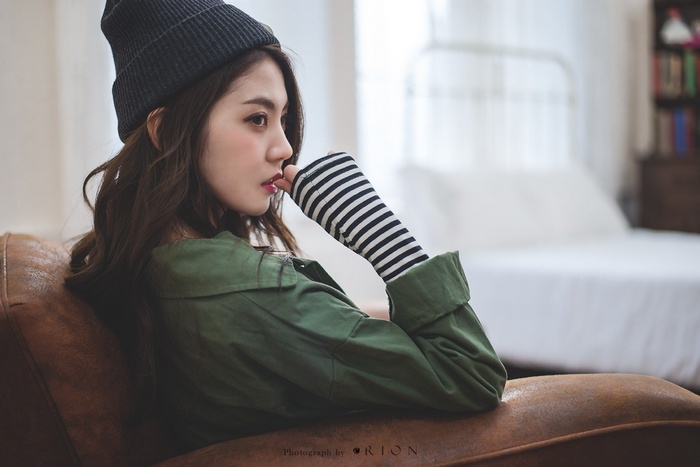 Chae Eun wearing a beanie and green jacket