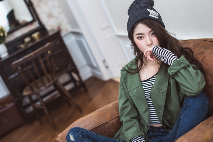 Chae Eun wearing a beanie and green jacket