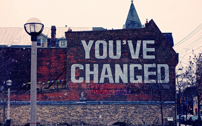 Graffiti on a brick building with a street light