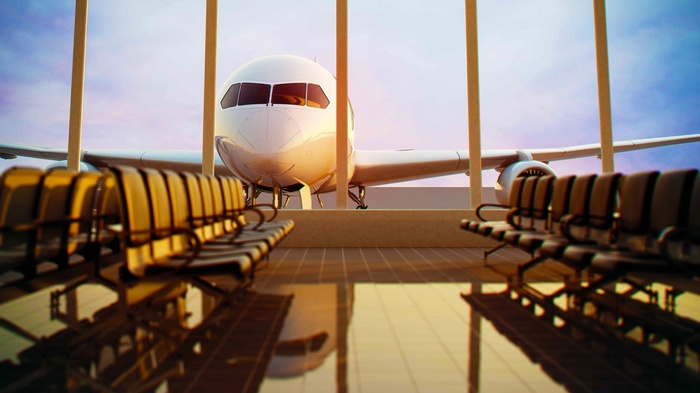 Airport waiting area with airplane visible through windows