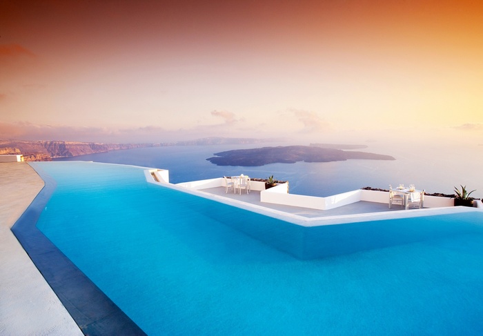 Infinity pool overlooking the sea in Santorini, Greece