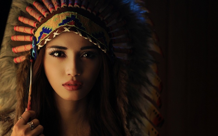 Woman wearing a Native American headdress