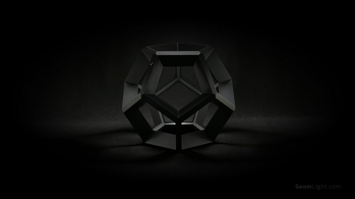 Black geometric object on a dark background