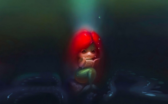 Ariel the mermaid reads a book underwater