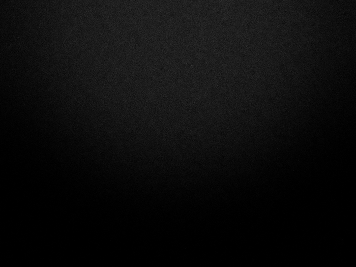 Black textured surface with subtle gradient