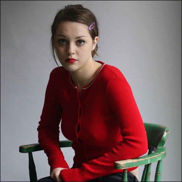 Imogen Dyer sitting on a green chair