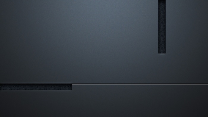 Dark gray textured surface with geometric cutouts