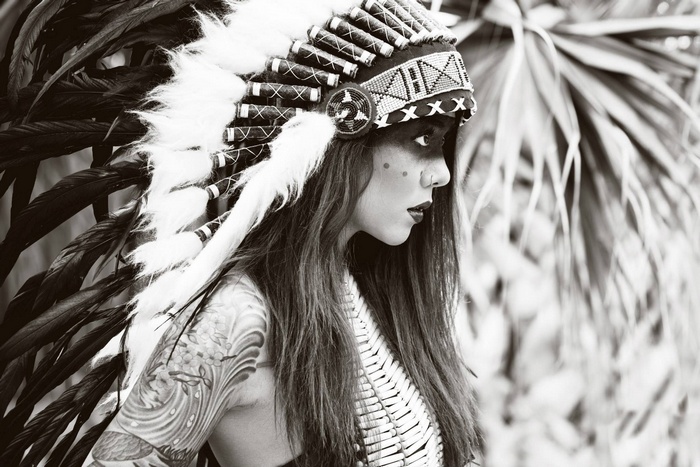 Woman wearing a Native American headdress