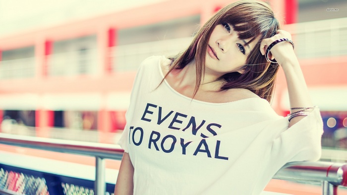 Asian woman with text on shirt