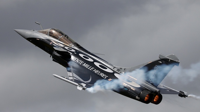 Dassault Rafale performing aerobatics with smoke